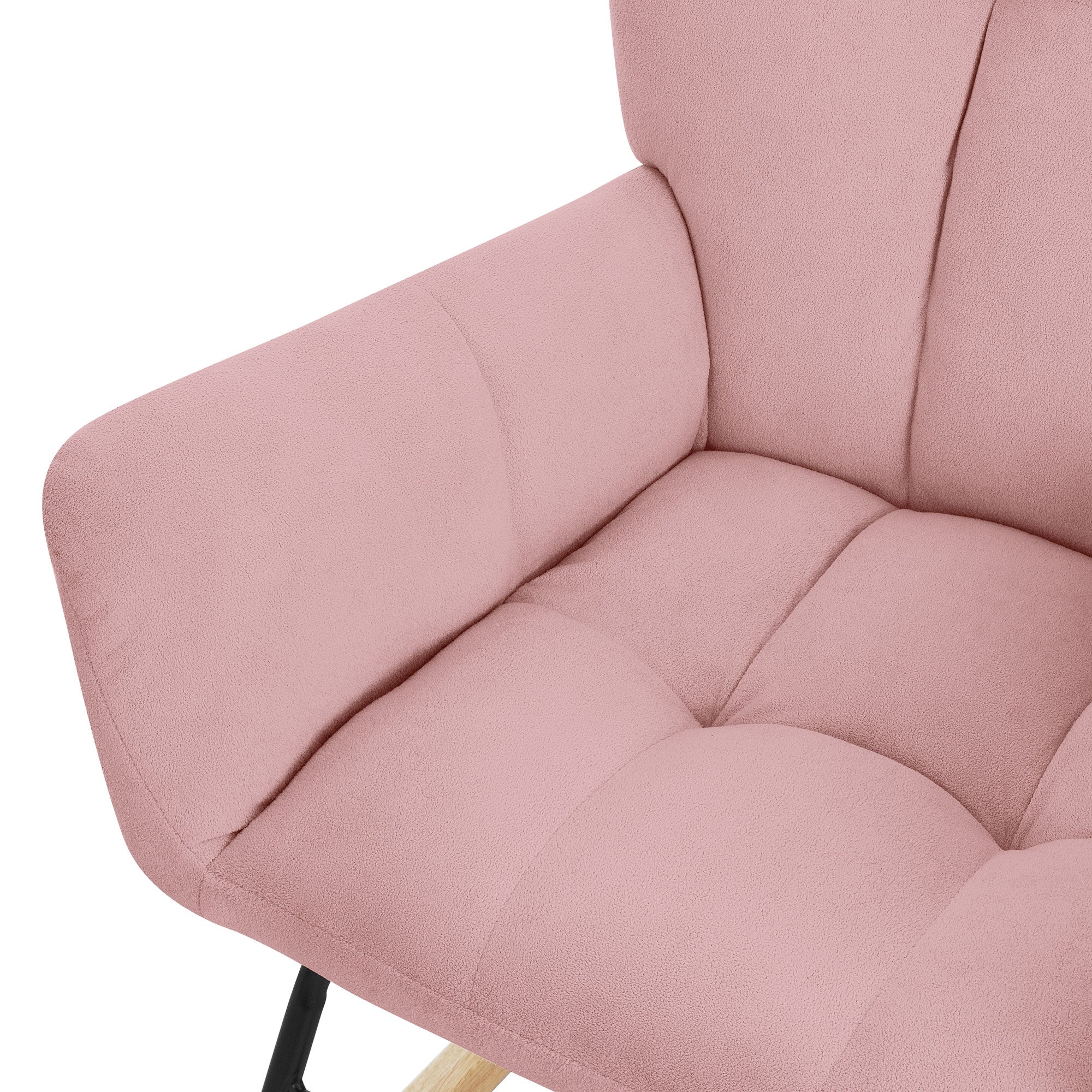 Close-up of a pink armchair with a padded seat and armrests.