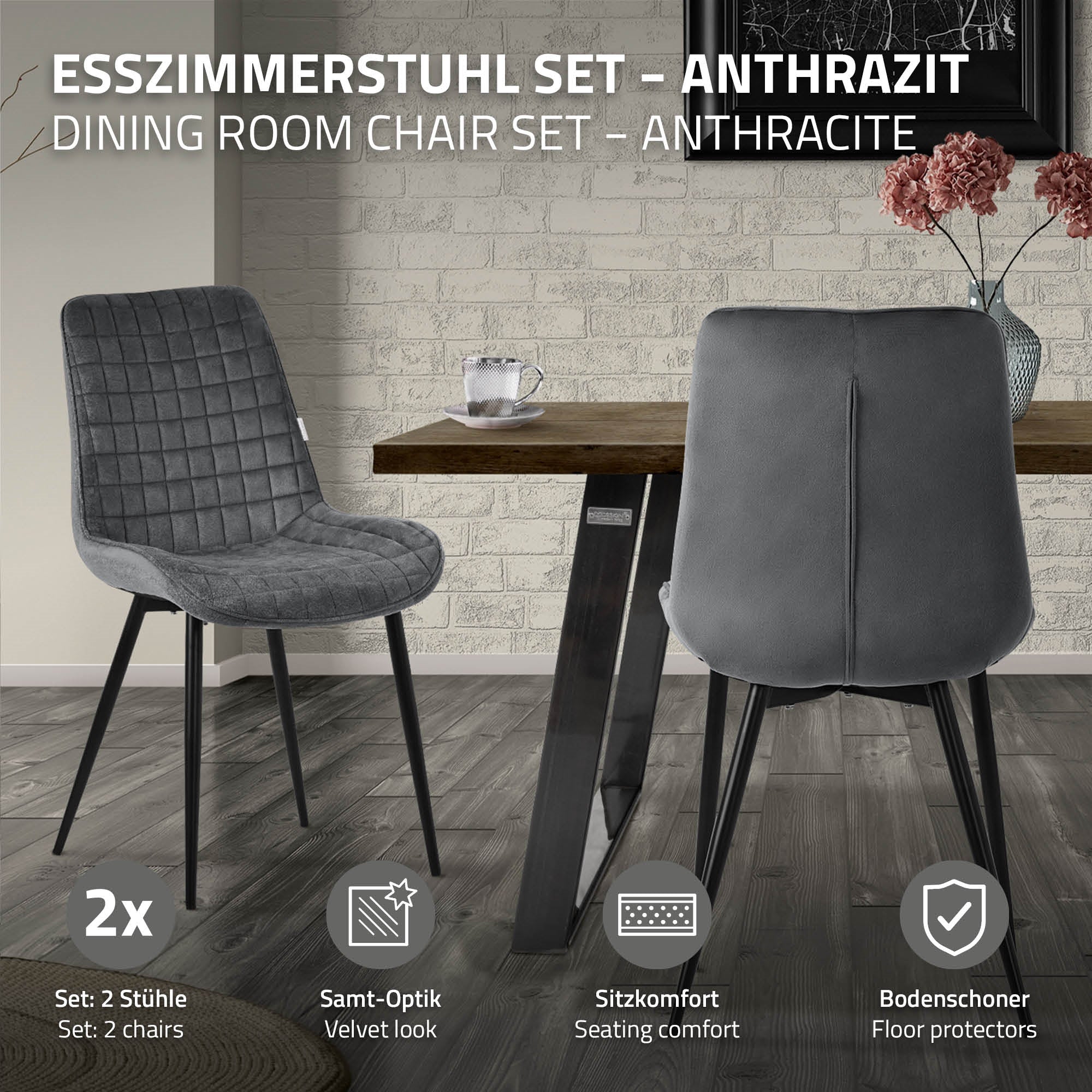 Deux chaises anthracite devant une table dans une pièce moderne.