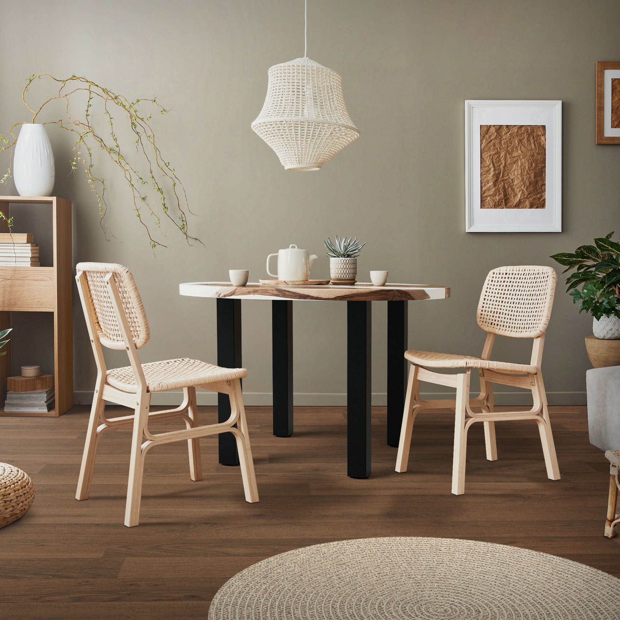 Dining area with a table, two chairs, and a pendant light.