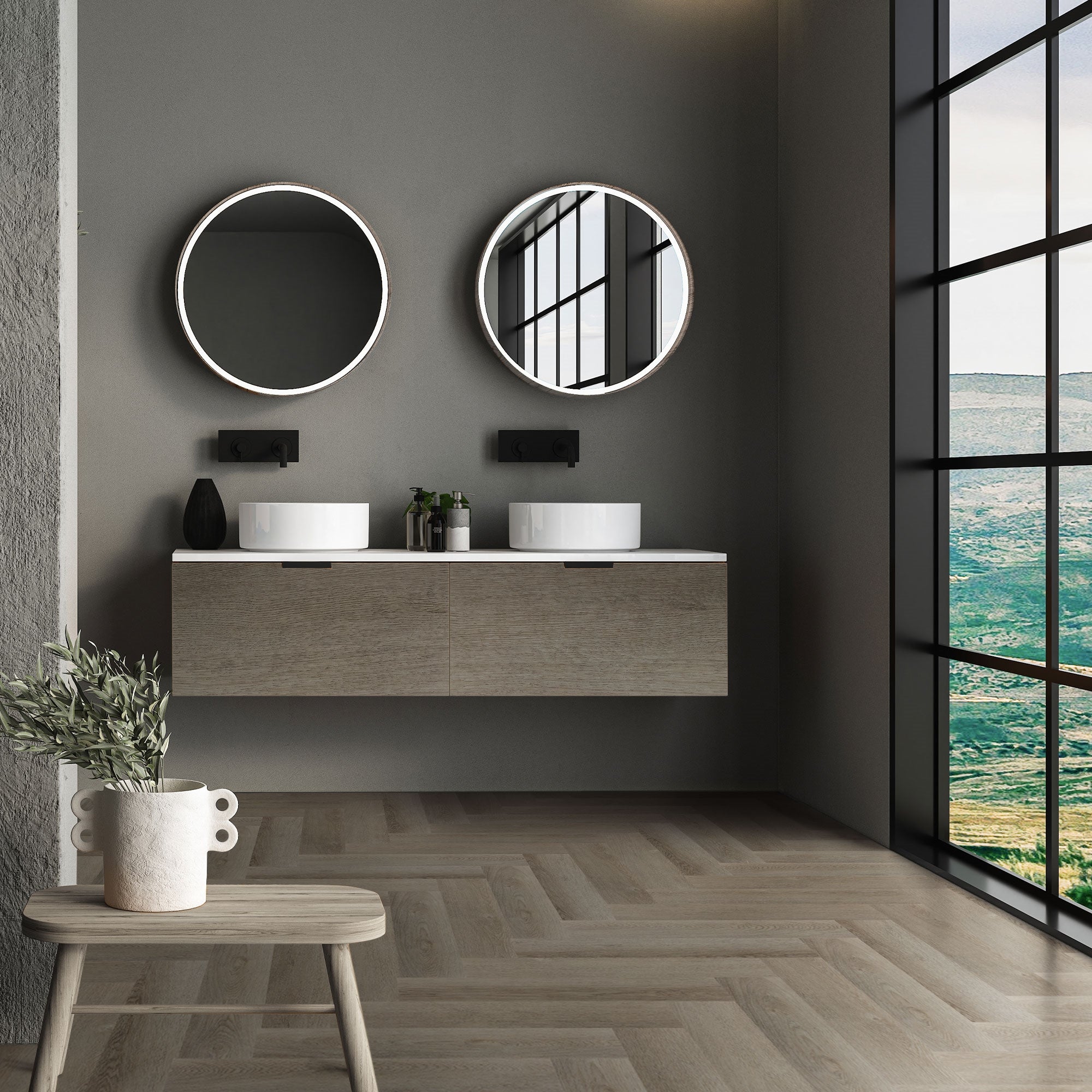 Badezimmer mit zwei Waschbecken, runden Spiegeln und Fensterblick.