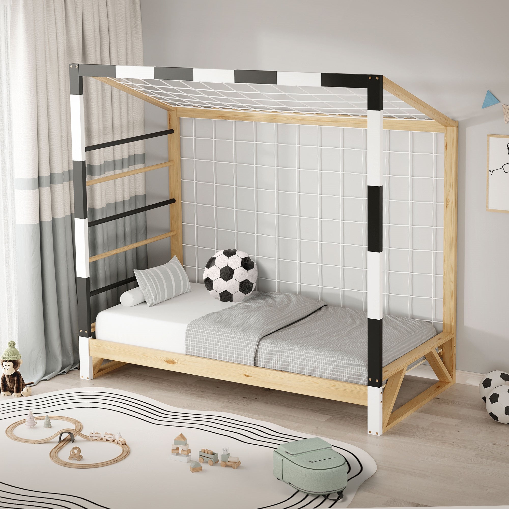 Ein Kinderbett mit Kletterleiter und Fußballmotiv, in einem hellen Raum.
