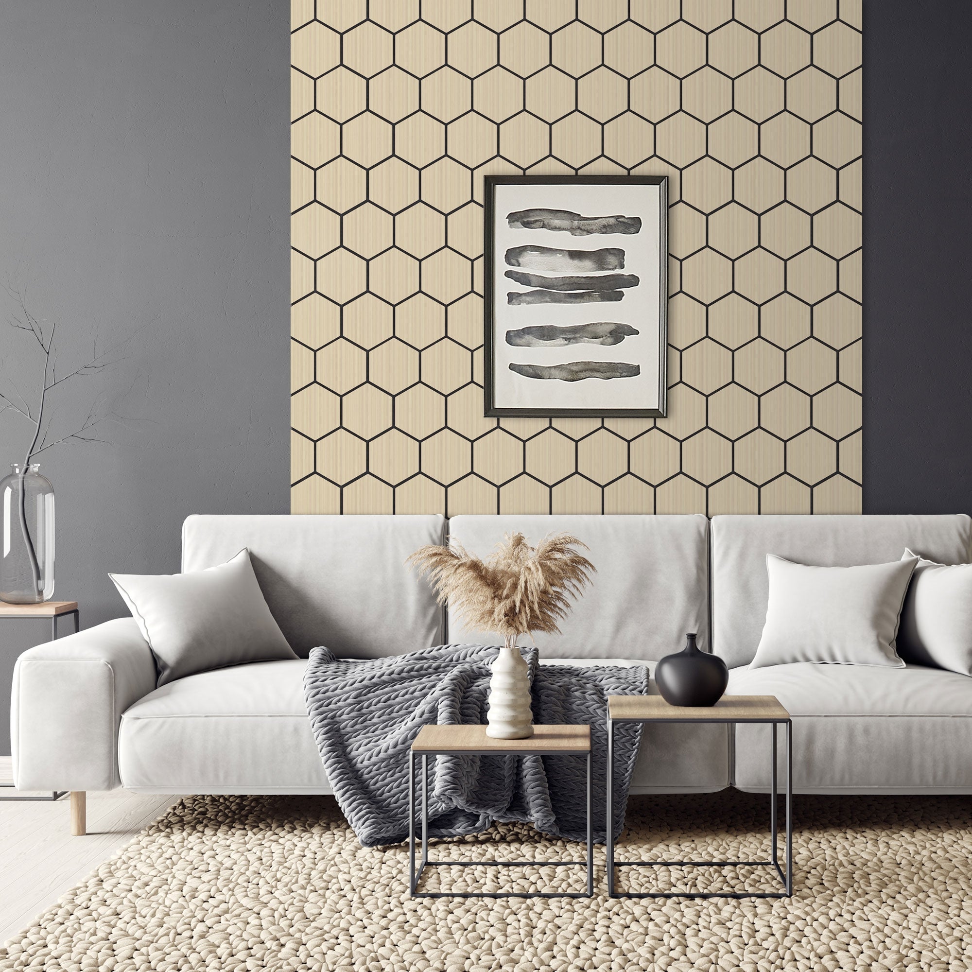 Et moderne stue med sofa, bord og vægdekoration.