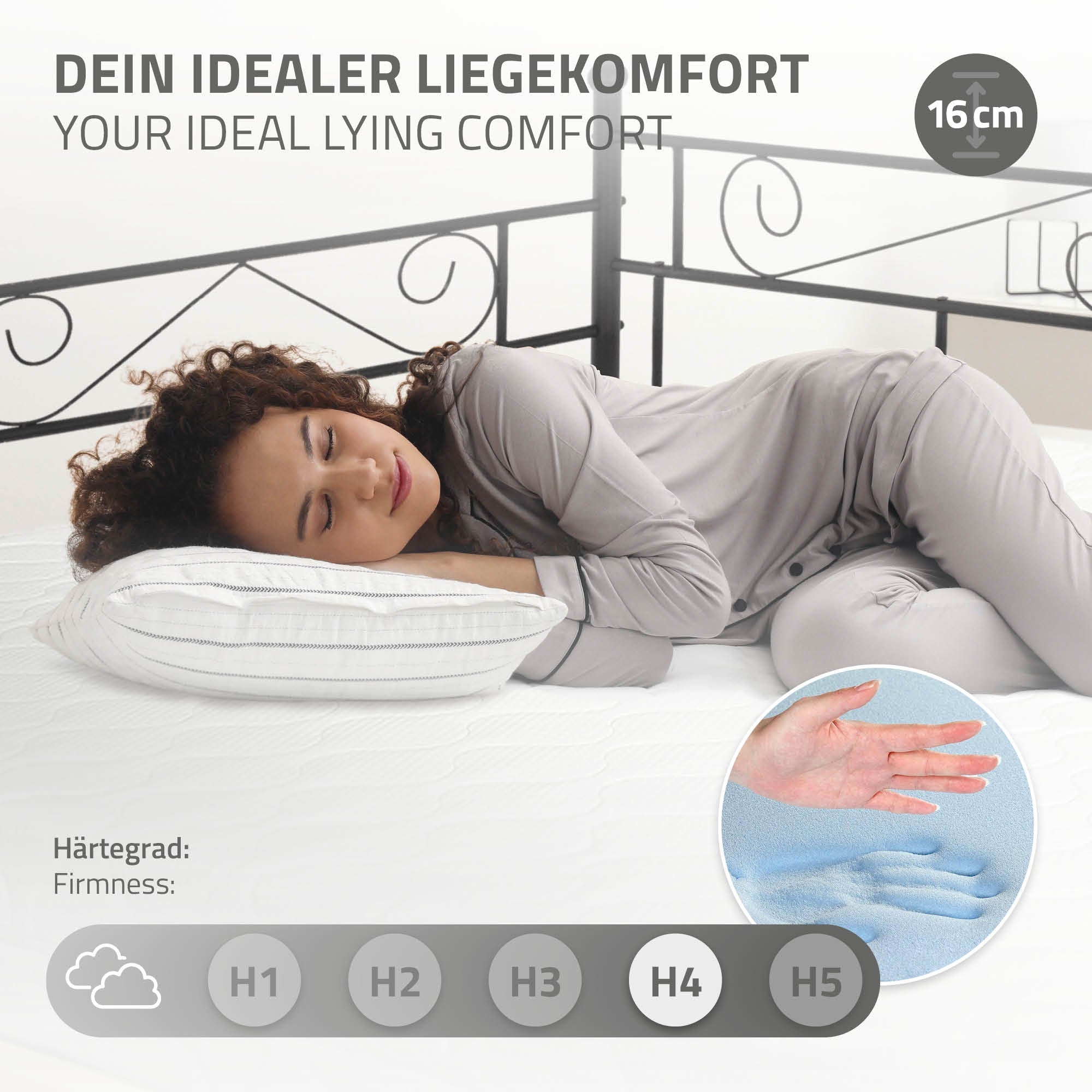 Person liegt auf einer Matratze mit Kissen, zeigt Liegekomfort.