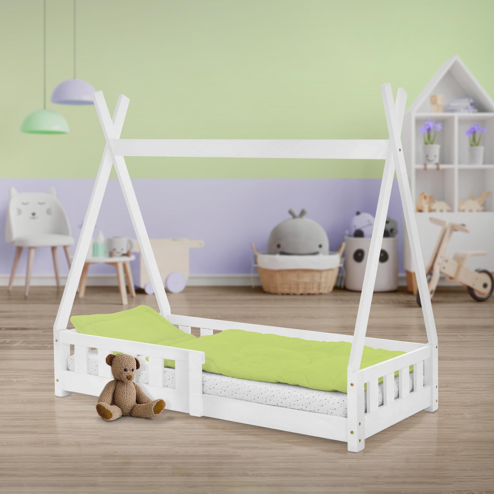 White bed in the children's room with toys and green bedding.