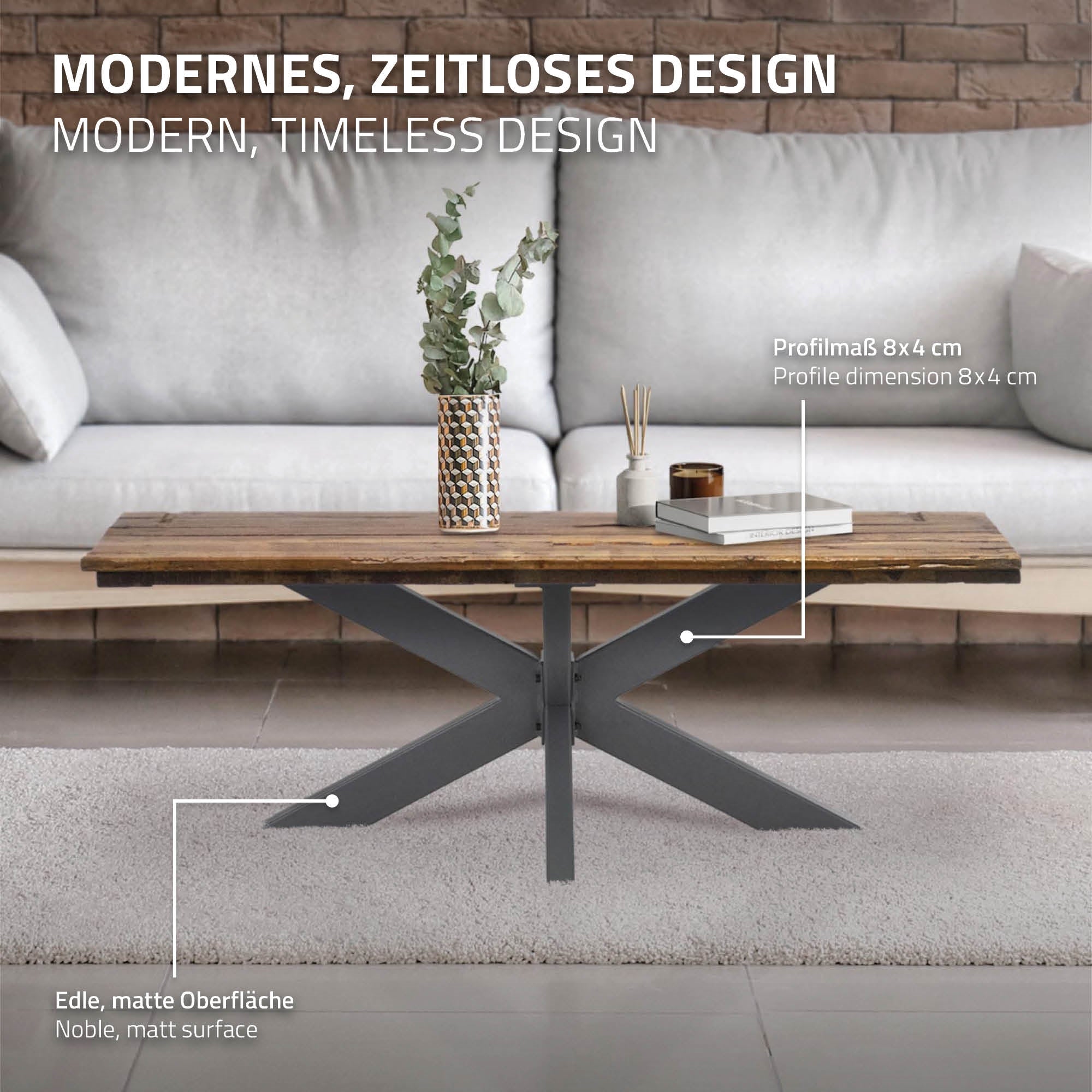 A coffee table with a matte surface and modern design. A plant and a book li