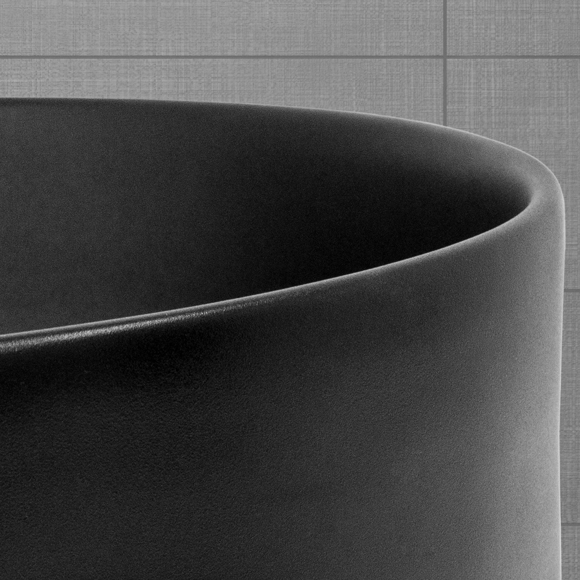 Close-up van een zwarte, ronde container met een gladde oppervlakte.