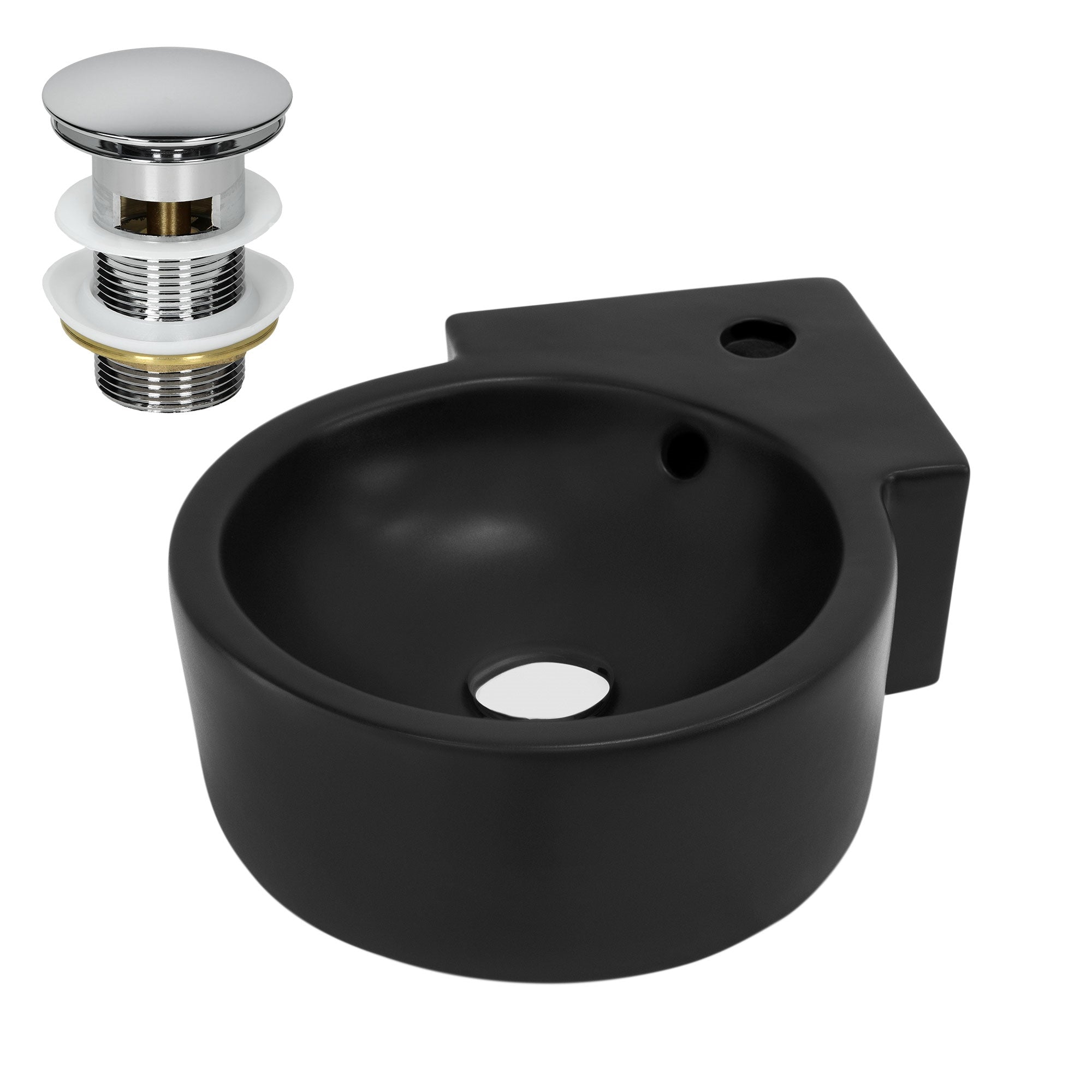Lavabo nero con scarico e un foro rotondo al centro.