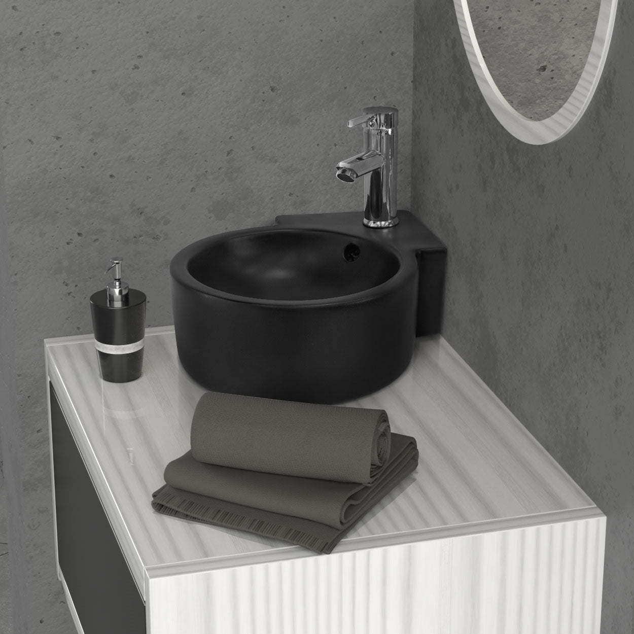 Lavabo nero con asciugamani su un tavolo.