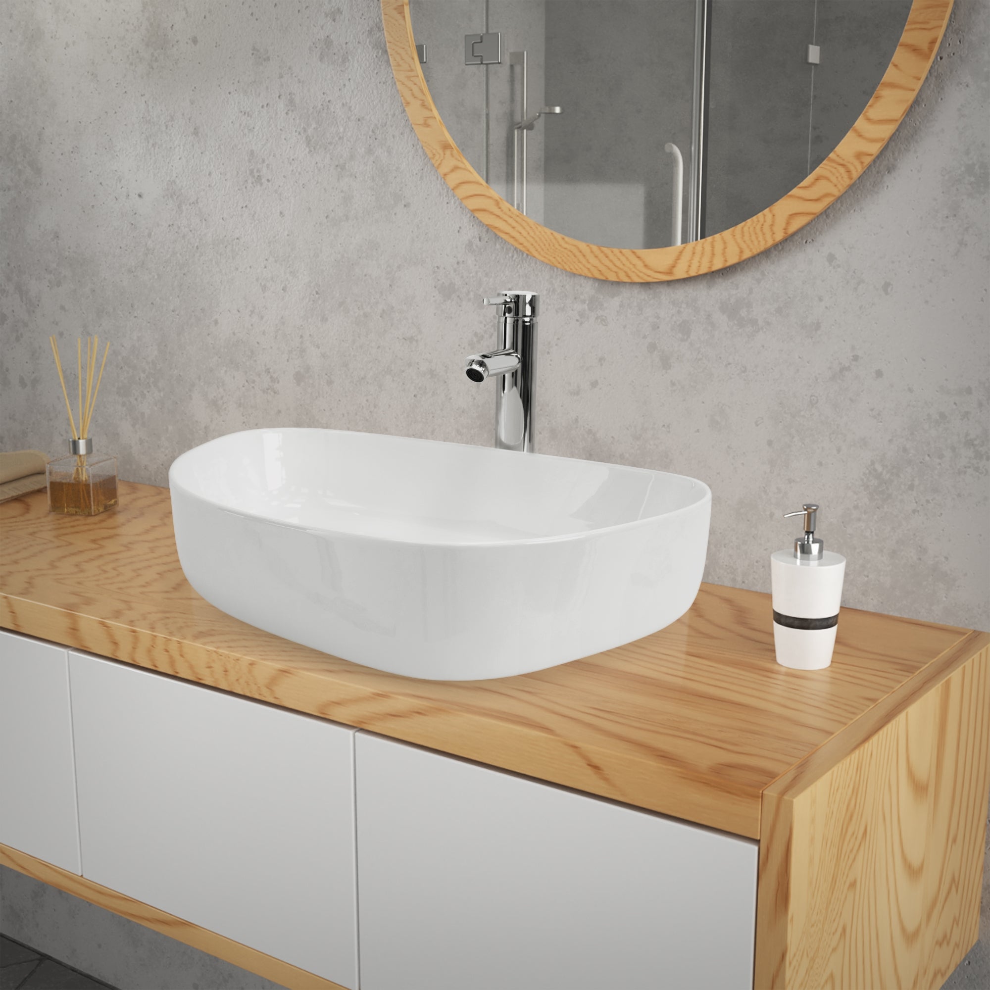 Un lavabo blanc sur une table en bois devant un mur gris.