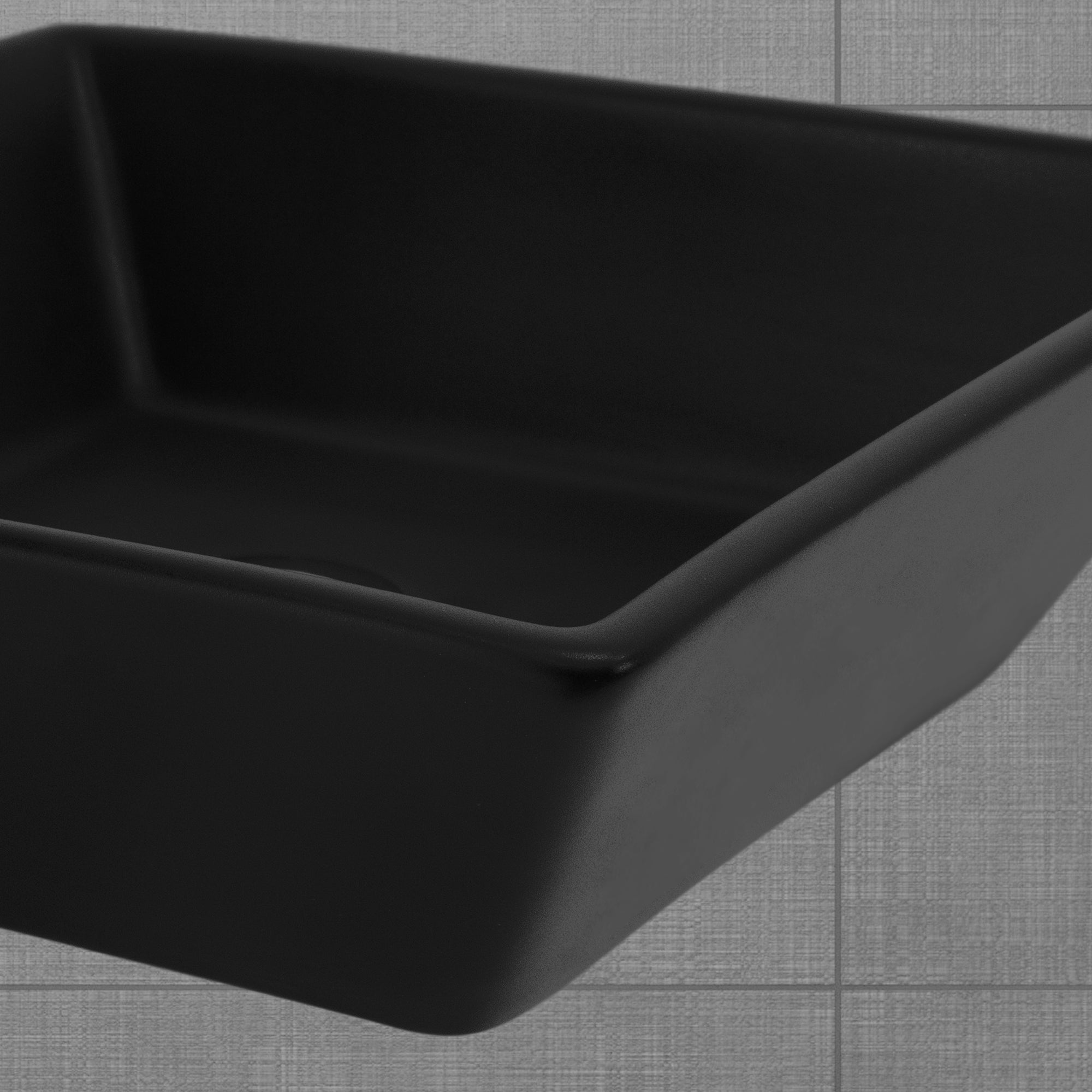 Black rectangular bowl on a gray background.