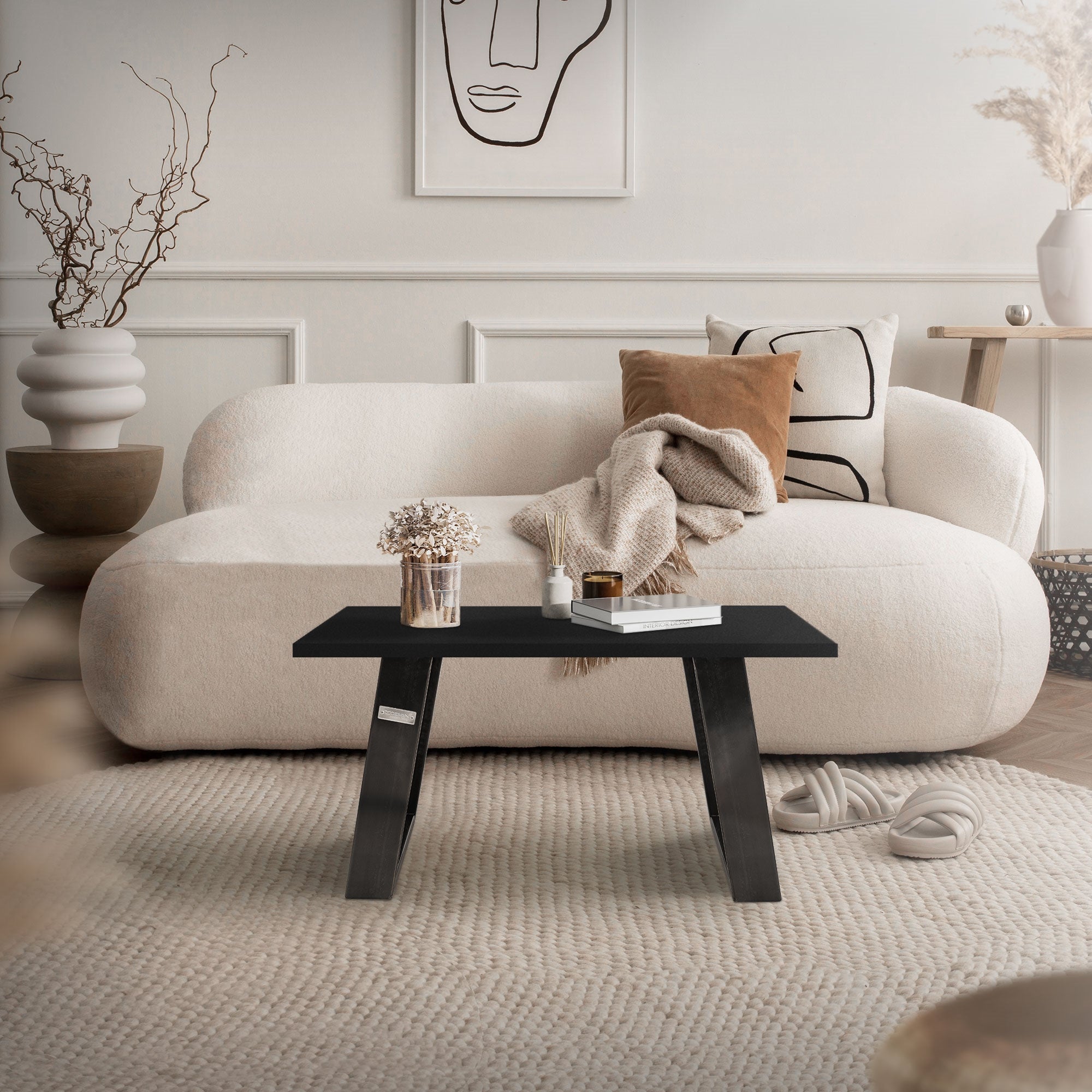 A modern living space with a sofa and a table.