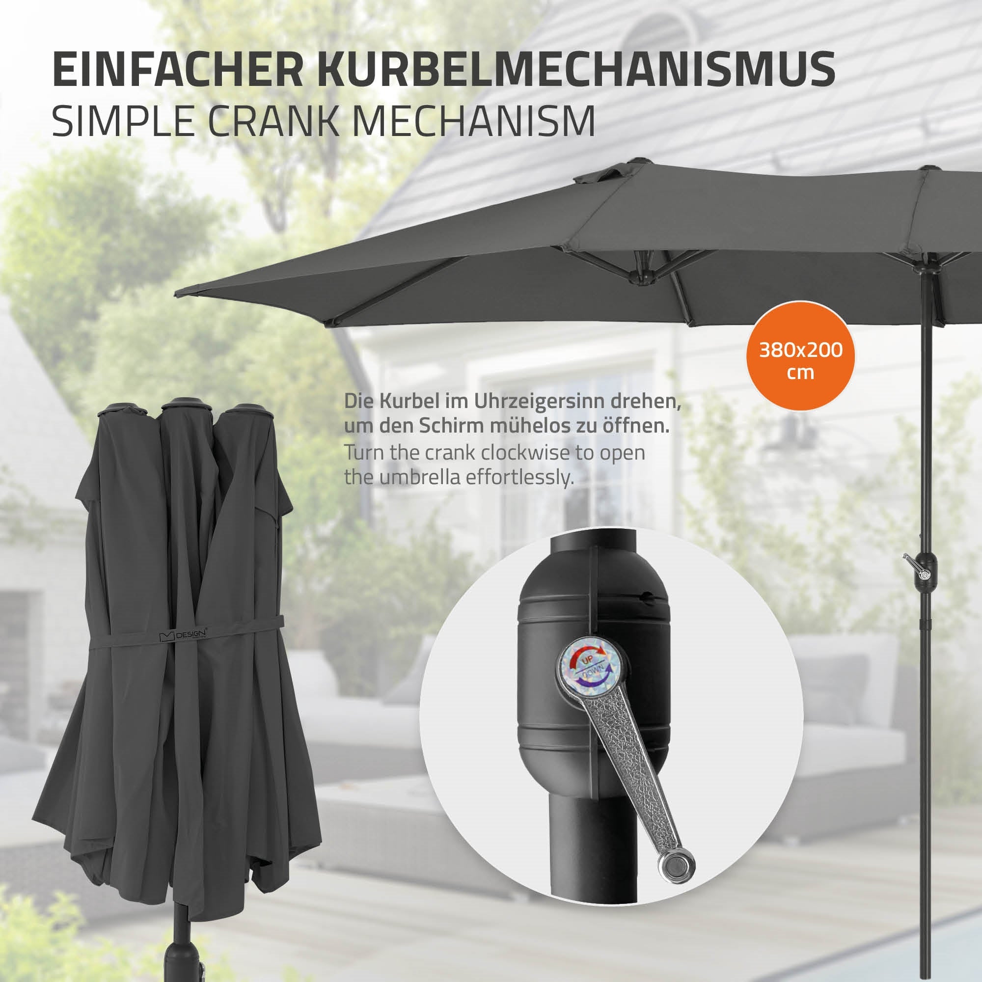 Schirm mit Kurbelmechanismus und grauem Stoff, auf einem Tisch.