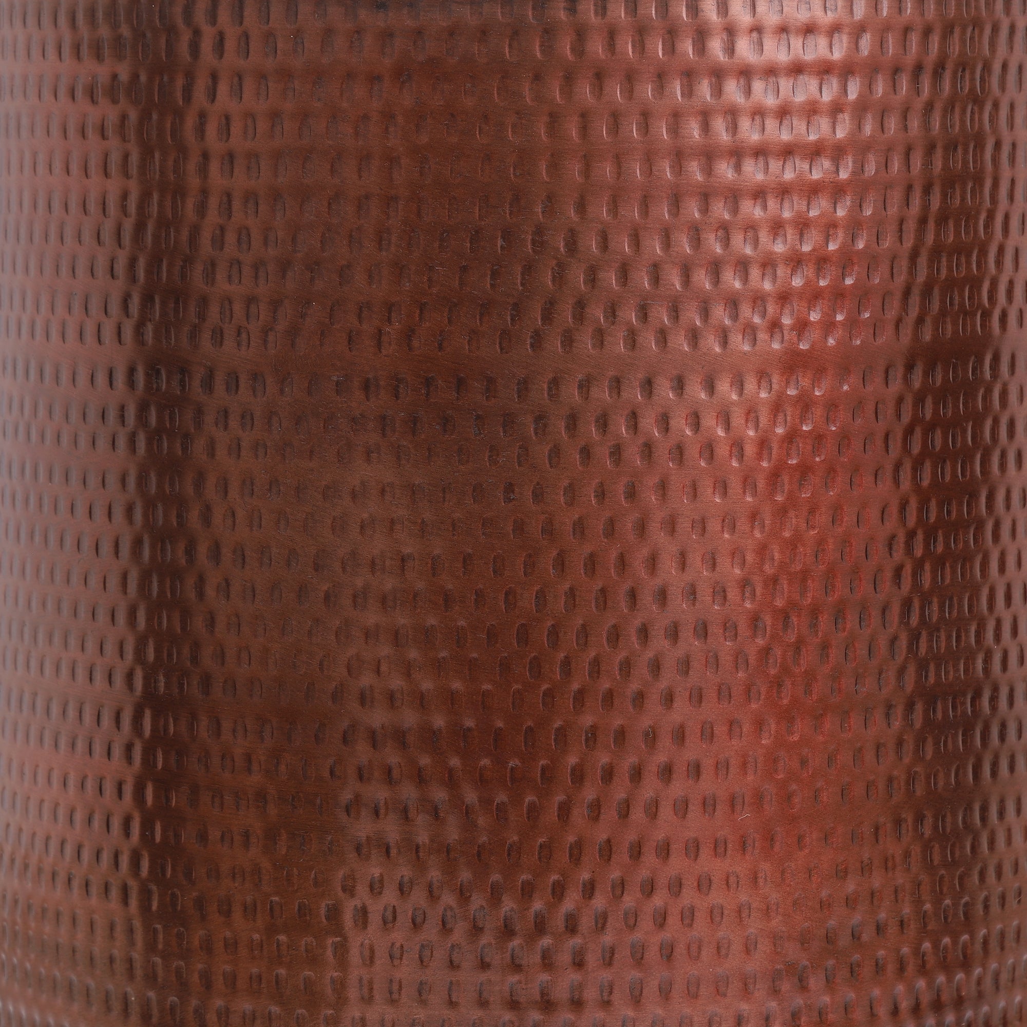 Brown, metallic container with textured surface.