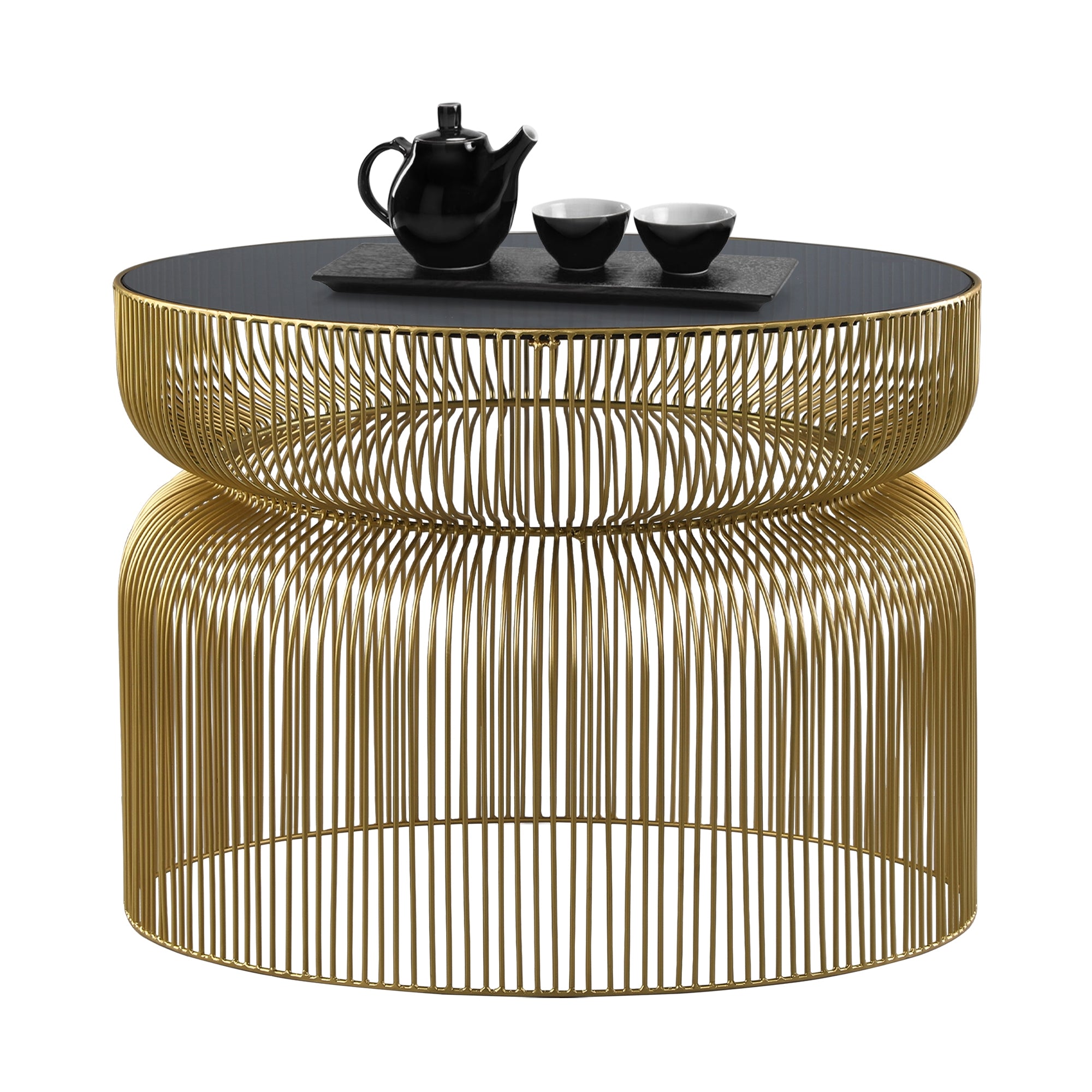 Ronde tafel met gouden draadframe en zwart tafelblad, met een theepot en kommen erop.